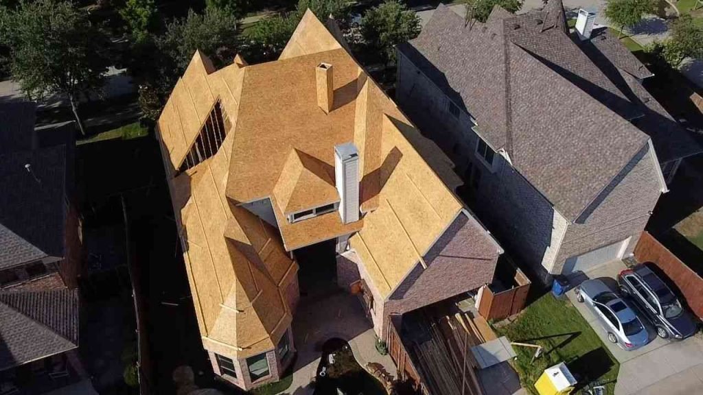 Home with a new roof being installed.